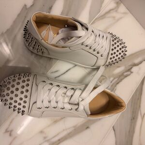 Christian Louboutin White Spiked Sneakers. Worn once